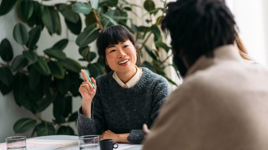 woman discussing project with colleagues