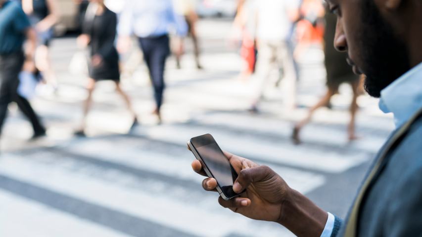 businessman holding a mobile phone