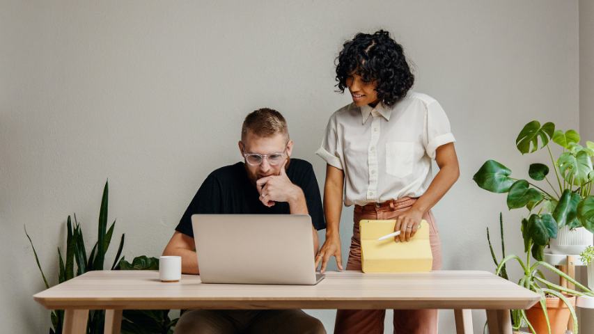 couple looking at laptop monitor