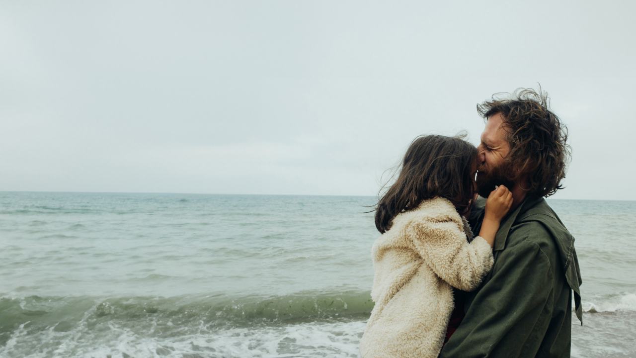 Father and daughter hugging on the beach