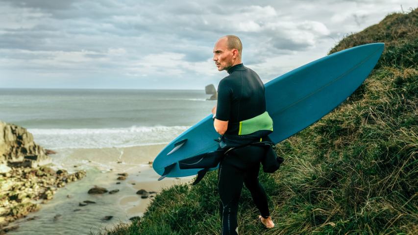 older man going to surf