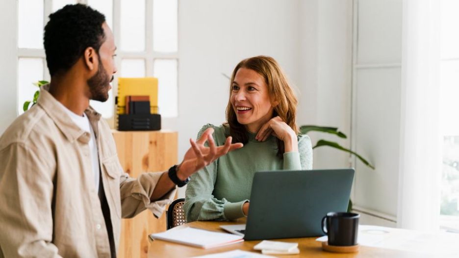 business colleagues discussing projects together in modern workspace